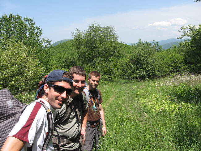 The team takes a break in a clearing