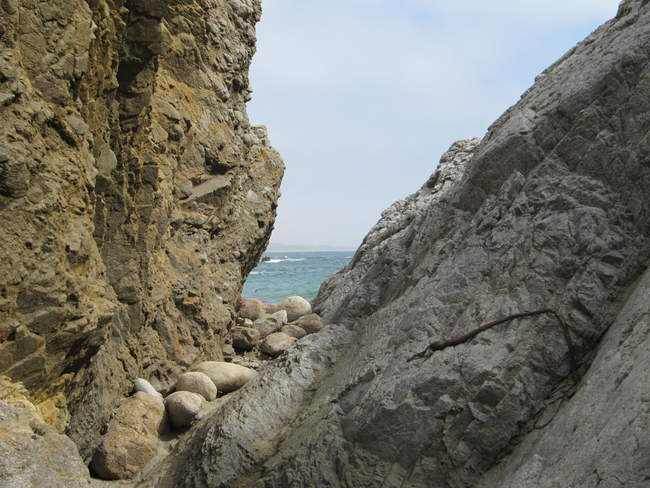 The opening on McClure's beach to get to the Monolith
