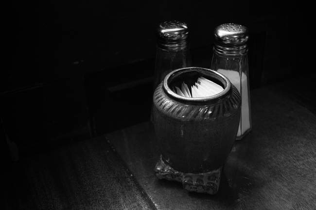 The light in the Blue Moon Cafe hits the salt and pepper shakers