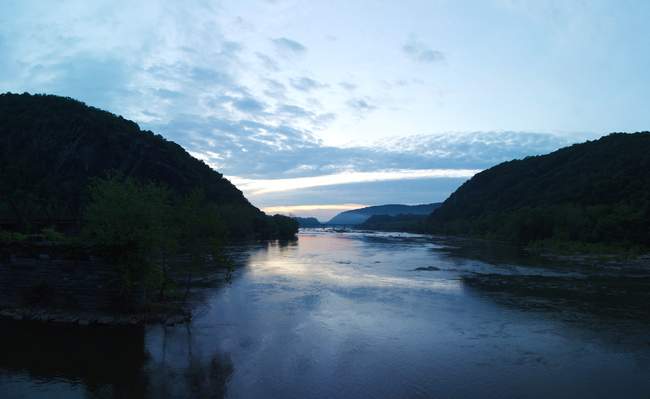 The sun sets over the river