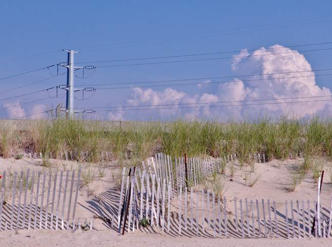 The road right behind the dunes makes for an interesting contrast.