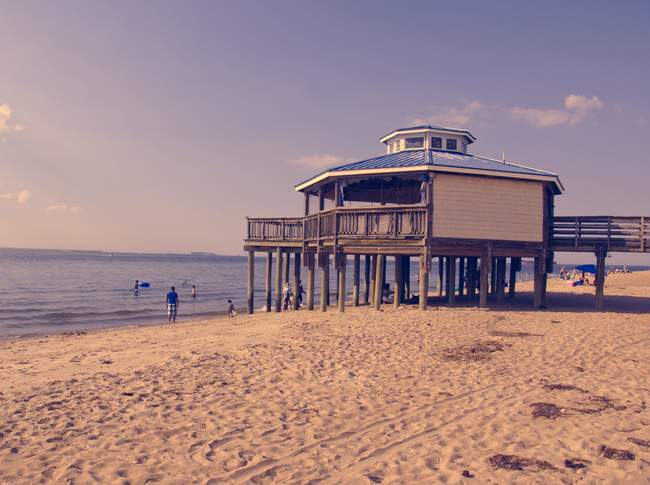 This little pier is in disrepair, but the beach-goers don't mind.